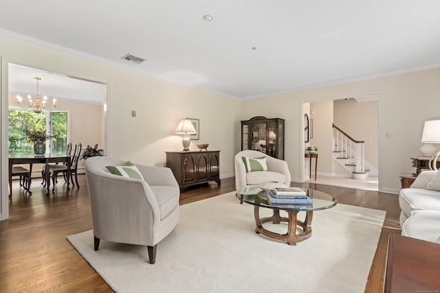 78 Carriage Rd, Wilton, CT 06897 - living area featuring stairs, crown molding, wood finished floors, and a chandelier