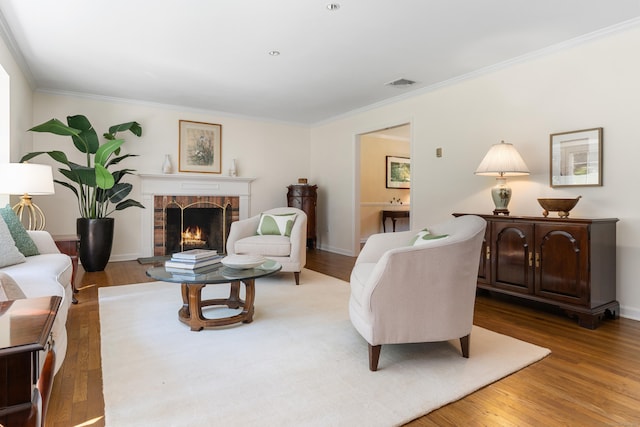 78 Carriage Rd, Wilton, CT 06897 - living area with a brick fireplace, crown molding, and wood finished floors