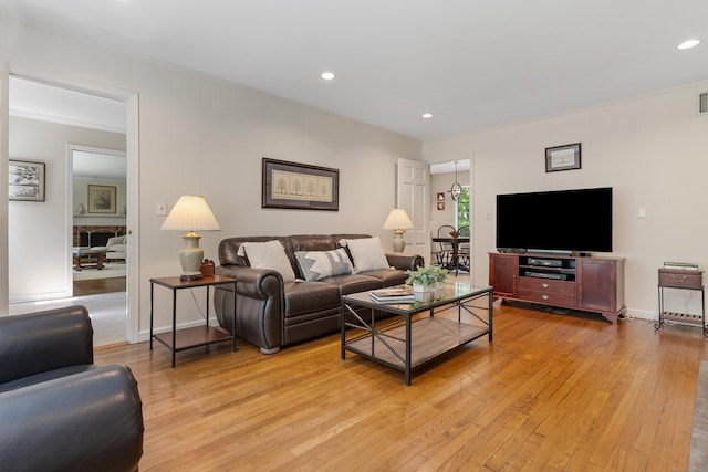 78 Carriage Rd, Wilton, CT 06897 - living area featuring light wood-style flooring, recessed lighting, and crown molding