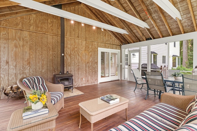 78 Carriage Rd, Wilton, CT 06897 - living area featuring wooden walls, a wood stove, high vaulted ceiling, hardwood / wood-style flooring, and a wooden ceiling with exposed beams