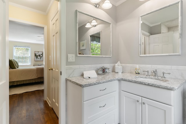 78 Carriage Rd, Wilton, CT 06897 - bathroom with vanity, hardwood / wood-style floors, crown molding, and ensuite bath