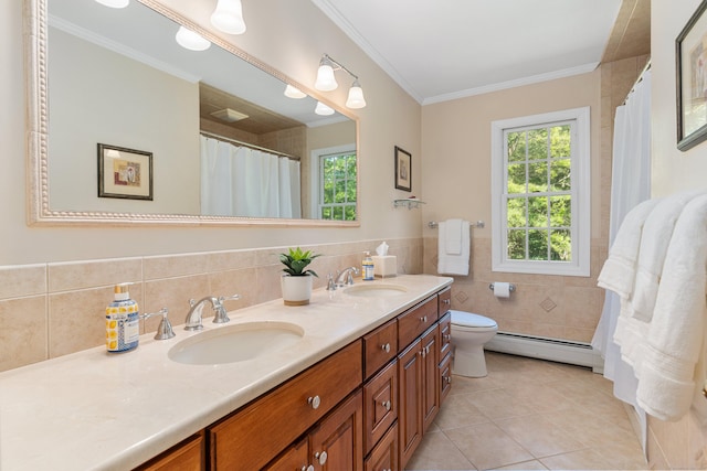 78 Carriage Rd, Wilton, CT 06897 - bathroom featuring a baseboard radiator, tile patterned flooring, double vanity, crown molding, and tile walls
