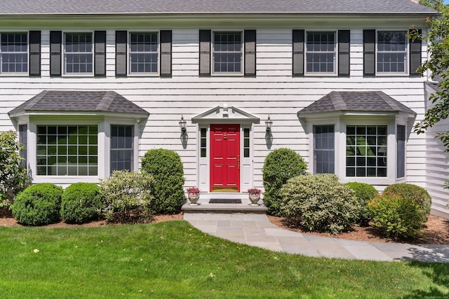 78 Carriage Rd, Wilton, CT 06897 - view of front of property with a front lawn and a shingled roof