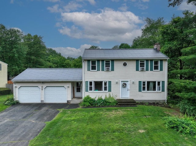 17 Plainfield St, Enfield, CT 06082 - colonial inspired home with a garage, a chimney, asphalt driveway, and a front yard