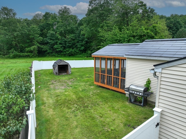 17 Plainfield St, Enfield, CT 06082 - fenced backyard featuring a sunroom and a view of trees