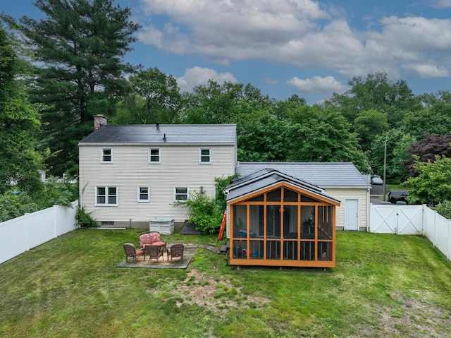 17 Plainfield St, Enfield, CT 06082 - back of house with a fenced backyard, a patio, a chimney, a sunroom, and a gate