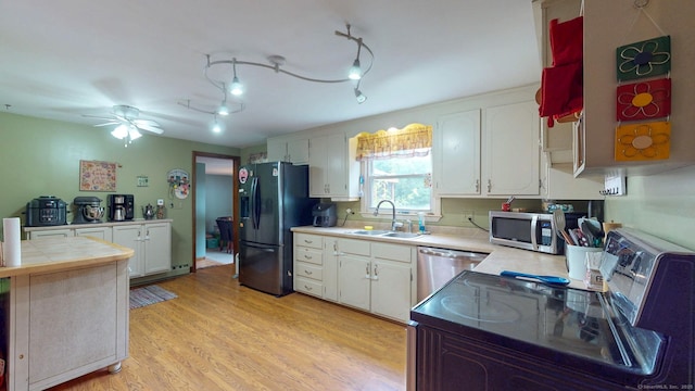 17 Plainfield St, Enfield, CT 06082 - kitchen with appliances with stainless steel finishes, white cabinets, ceiling fan, light wood-type flooring, and tile counters