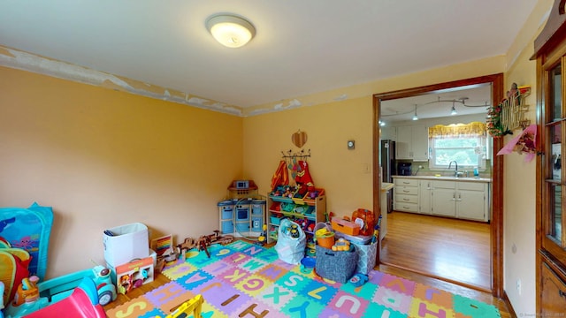 17 Plainfield St, Enfield, CT 06082 - recreation room featuring a sink and light wood-style floors
