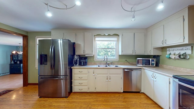 17 Plainfield St, Enfield, CT 06082 - kitchen with stainless steel appliances, white cabinetry, and light countertops