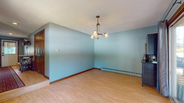 17 Plainfield St, Enfield, CT 06082 - unfurnished room with a chandelier, wood finished floors, baseboard heating, and recessed lighting