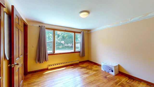 17 Plainfield St, Enfield, CT 06082 - empty room featuring a baseboard heating unit and light wood-type flooring