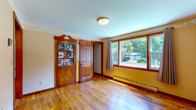 17 Plainfield St, Enfield, CT 06082 - spare room featuring baseboard heating and light wood-style flooring