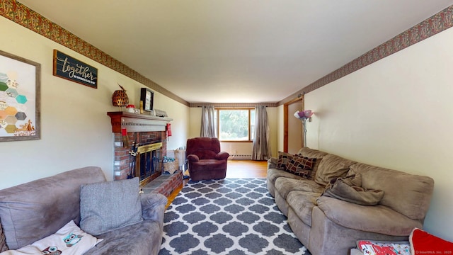 17 Plainfield St, Enfield, CT 06082 - living room featuring a brick fireplace and wood finished floors