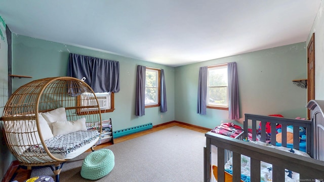 17 Plainfield St, Enfield, CT 06082 - bedroom featuring a baseboard heating unit, wood finished floors, and cooling unit
