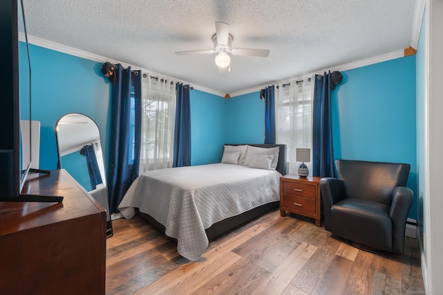 529 Orchard St, Rocky Hill, CT 06067 - bedroom with ornamental molding, wood finished floors, a textured ceiling, and ceiling fan