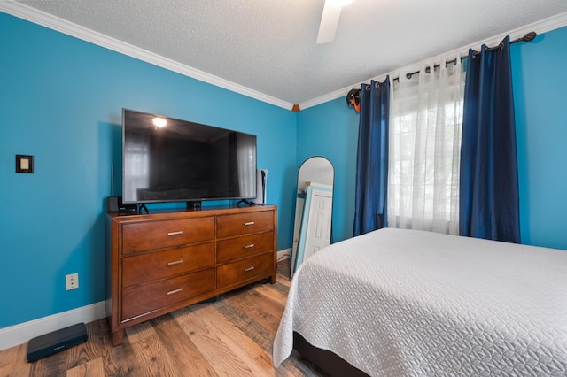 529 Orchard St, Rocky Hill, CT 06067 - bedroom featuring wood finished floors, ornamental molding, a ceiling fan, and a textured ceiling