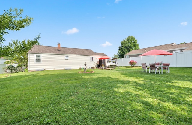 529 Orchard St, Rocky Hill, CT 06067 - back of house with a fenced backyard and a chimney