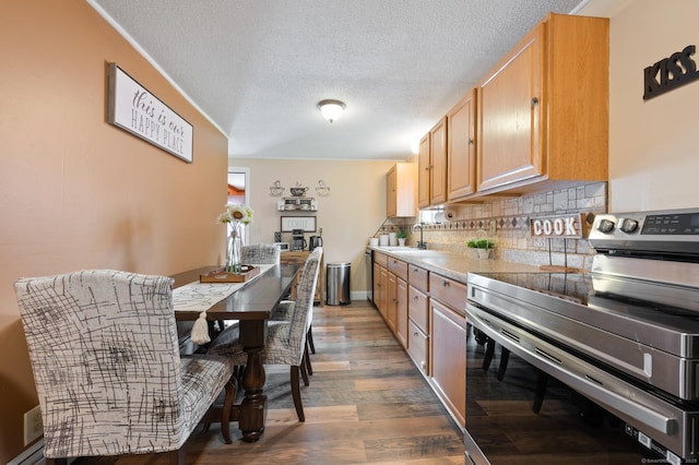 529 Orchard St, Rocky Hill, CT 06067 - kitchen featuring stainless steel range with electric cooktop, wood finished floors, decorative backsplash, a textured ceiling, and light countertops