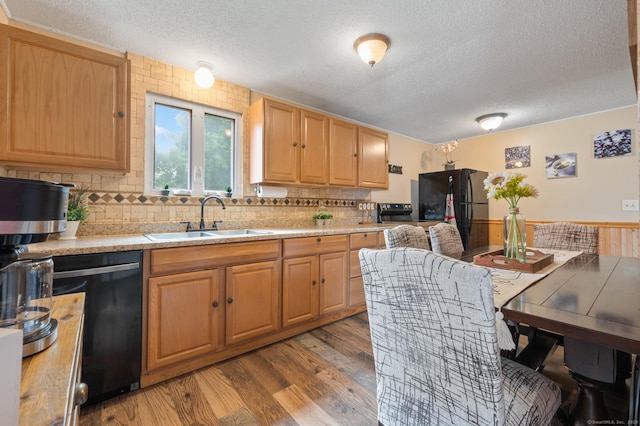 529 Orchard St, Rocky Hill, CT 06067 - kitchen with black appliances, a textured ceiling, light countertops, light wood-style floors, and tasteful backsplash
