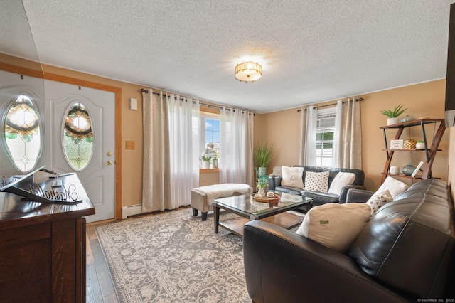 529 Orchard St, Rocky Hill, CT 06067 - living room with a textured ceiling, baseboard heating, and wood finished floors