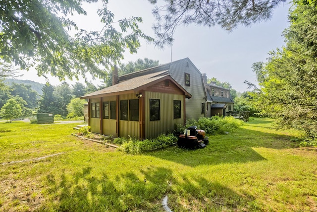 317 Turnpike Rd, Somers, CT 06071 - view of side of property featuring a yard and a chimney