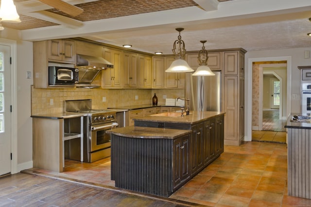 317 Turnpike Rd, Somers, CT 06071 - kitchen featuring appliances with stainless steel finishes, ventilation hood, backsplash, a kitchen island with sink, and dark stone counters