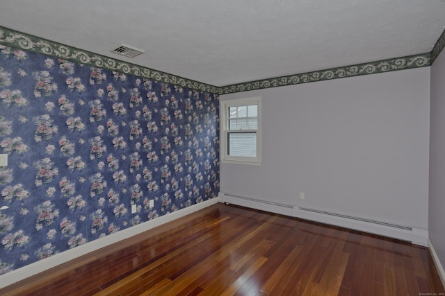 317 Turnpike Rd, Somers, CT 06071 - spare room featuring a baseboard radiator, wood finished floors, and wallpapered walls