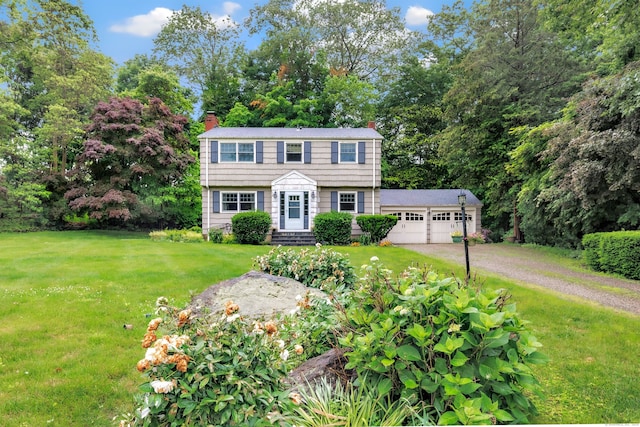 343 Steiner St, Fairfield, CT 06825 - colonial-style house with a chimney, a front lawn, a garage, and driveway