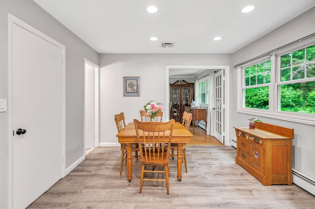 343 Steiner St, Fairfield, CT 06825 - dining room with plenty of natural light, baseboard heating, recessed lighting, and light wood-type flooring