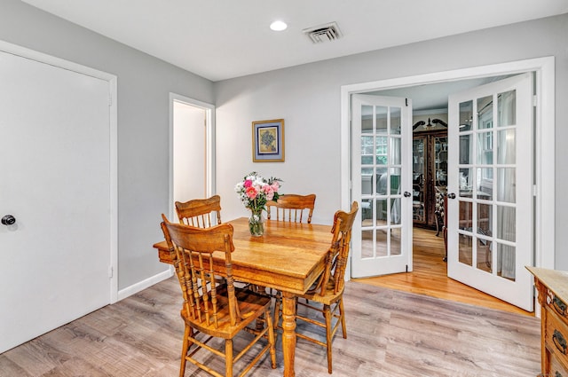 343 Steiner St, Fairfield, CT 06825 - dining room with french doors, light wood-style flooring, and recessed lighting