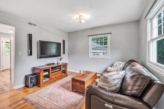 343 Steiner St, Fairfield, CT 06825 - living area with wood finished floors and healthy amount of natural light