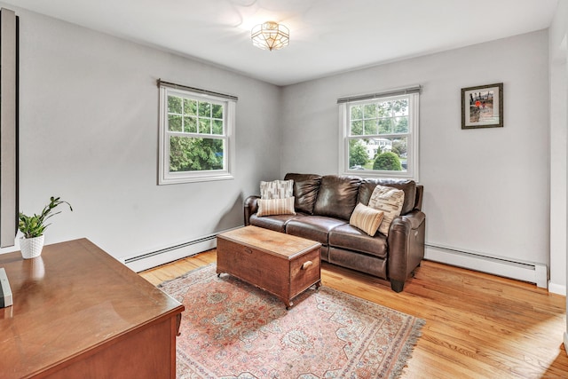 343 Steiner St, Fairfield, CT 06825 - living room featuring baseboard heating, plenty of natural light, and light wood-style flooring