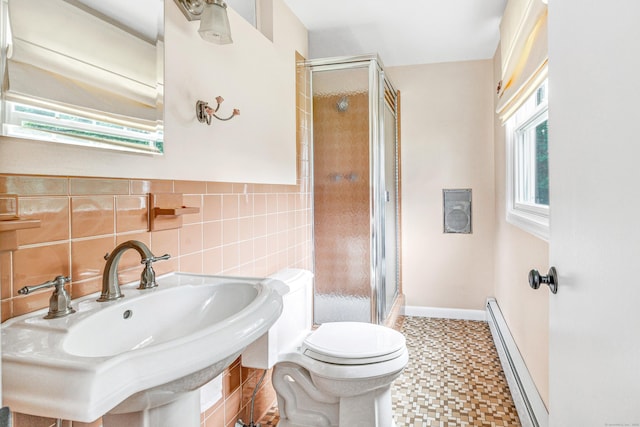 343 Steiner St, Fairfield, CT 06825 - full bathroom featuring a baseboard radiator, a shower stall, tile patterned floors, and tile walls