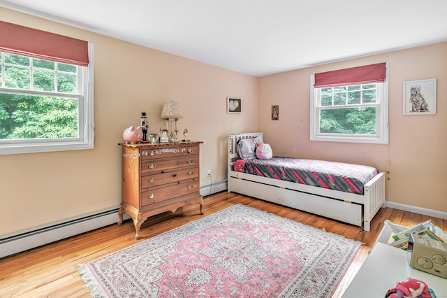 343 Steiner St, Fairfield, CT 06825 - bedroom featuring baseboard heating, multiple windows, and wood finished floors