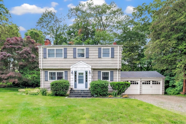 343 Steiner St, Fairfield, CT 06825 - colonial house featuring a chimney, a garage, a front lawn, and driveway