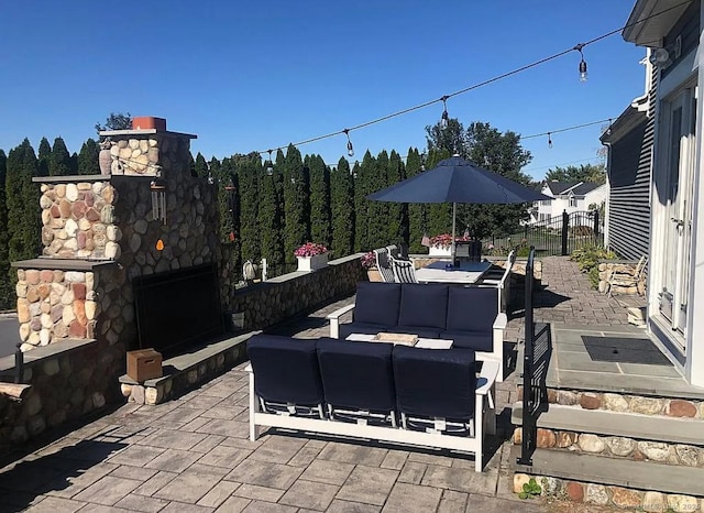 1 Far Horizon Dr, Wallingford, CT 06492 - view of patio / terrace with an outdoor living space with a fireplace