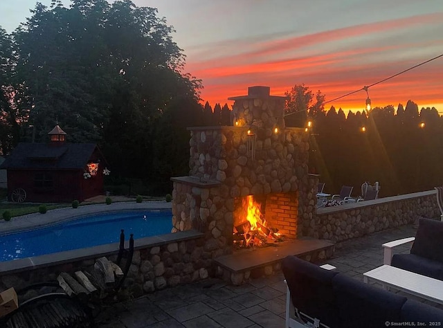 1 Far Horizon Dr, Wallingford, CT 06492 - swimming pool featuring an outdoor stone fireplace and a patio
