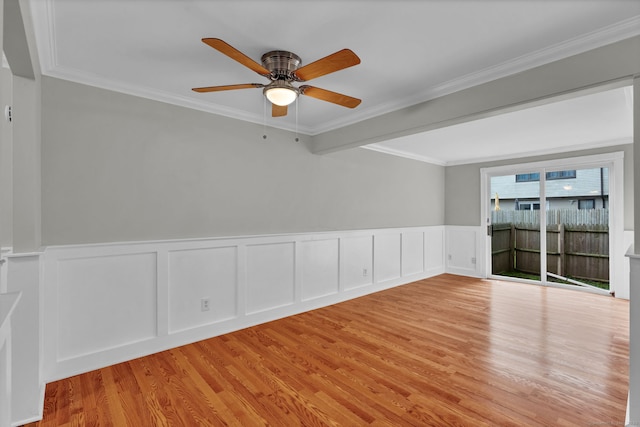 189 High Top Cir W Unit 189, Hamden, CT 06514 - empty room with light wood-style flooring, ceiling fan, crown molding, a decorative wall, and wainscoting