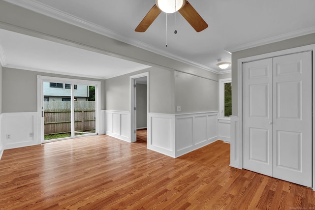189 High Top Cir W Unit 189, Hamden, CT 06514 - spare room with light wood-type flooring, ceiling fan, wainscoting, ornamental molding, and a decorative wall