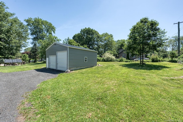 63 Fox Trl, Coventry, CT 06238 - view of grassy yard with a detached garage and an outdoor structure