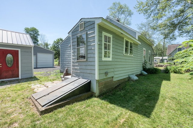 63 Fox Trl, Coventry, CT 06238 - view of property exterior with a lawn and a detached garage