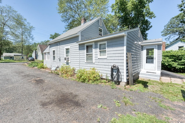 63 Fox Trl, Coventry, CT 06238 - view of property exterior with a chimney