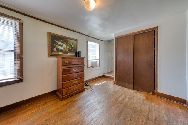 63 Fox Trl, Coventry, CT 06238 - bedroom with hardwood / wood-style flooring, ornamental molding, a closet, and cooling unit