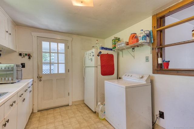 63 Fox Trl, Coventry, CT 06238 - washroom featuring washer / clothes dryer, cabinet space, and light flooring