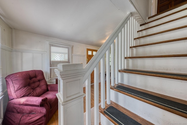 63 Fox Trl, Coventry, CT 06238 - stairs featuring a decorative wall, wood finished floors, and wainscoting