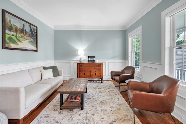 27 Bartlett Ln Unit 27, Shelton, CT 06484 - living room with plenty of natural light, dark wood finished floors, crown molding, a wainscoted wall, and a decorative wall