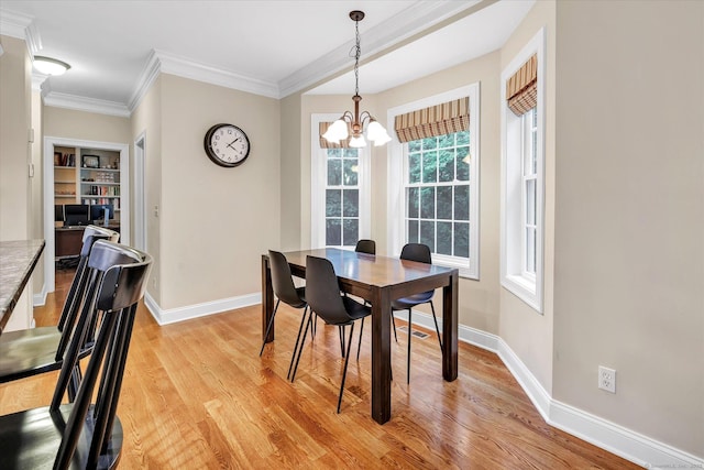 27 Bartlett Ln Unit 27, Shelton, CT 06484 - dining space featuring a chandelier, light wood finished floors, and crown molding