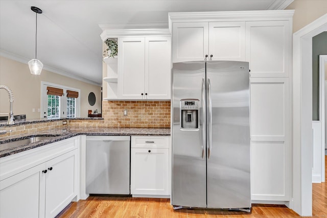 27 Bartlett Ln Unit 27, Shelton, CT 06484 - kitchen with appliances with stainless steel finishes, open shelves, crown molding, white cabinets, and dark stone countertops