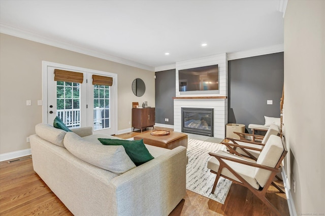 27 Bartlett Ln Unit 27, Shelton, CT 06484 - living room featuring ornamental molding, wood finished floors, a fireplace, and recessed lighting