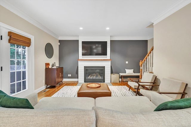 27 Bartlett Ln Unit 27, Shelton, CT 06484 - living room with wood finished floors, ornamental molding, recessed lighting, a large fireplace, and stairs